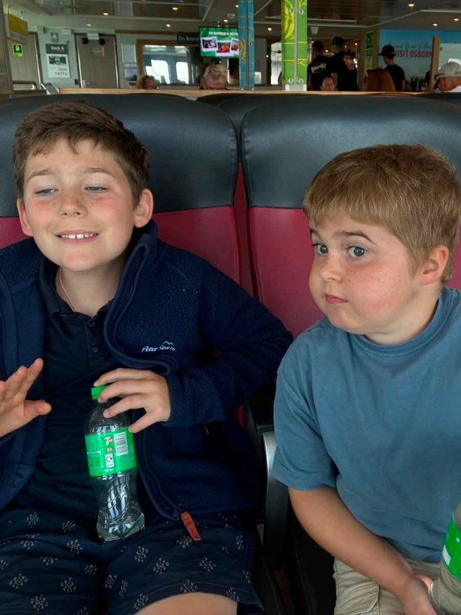 Two boys sitting together on board the Jumbulance