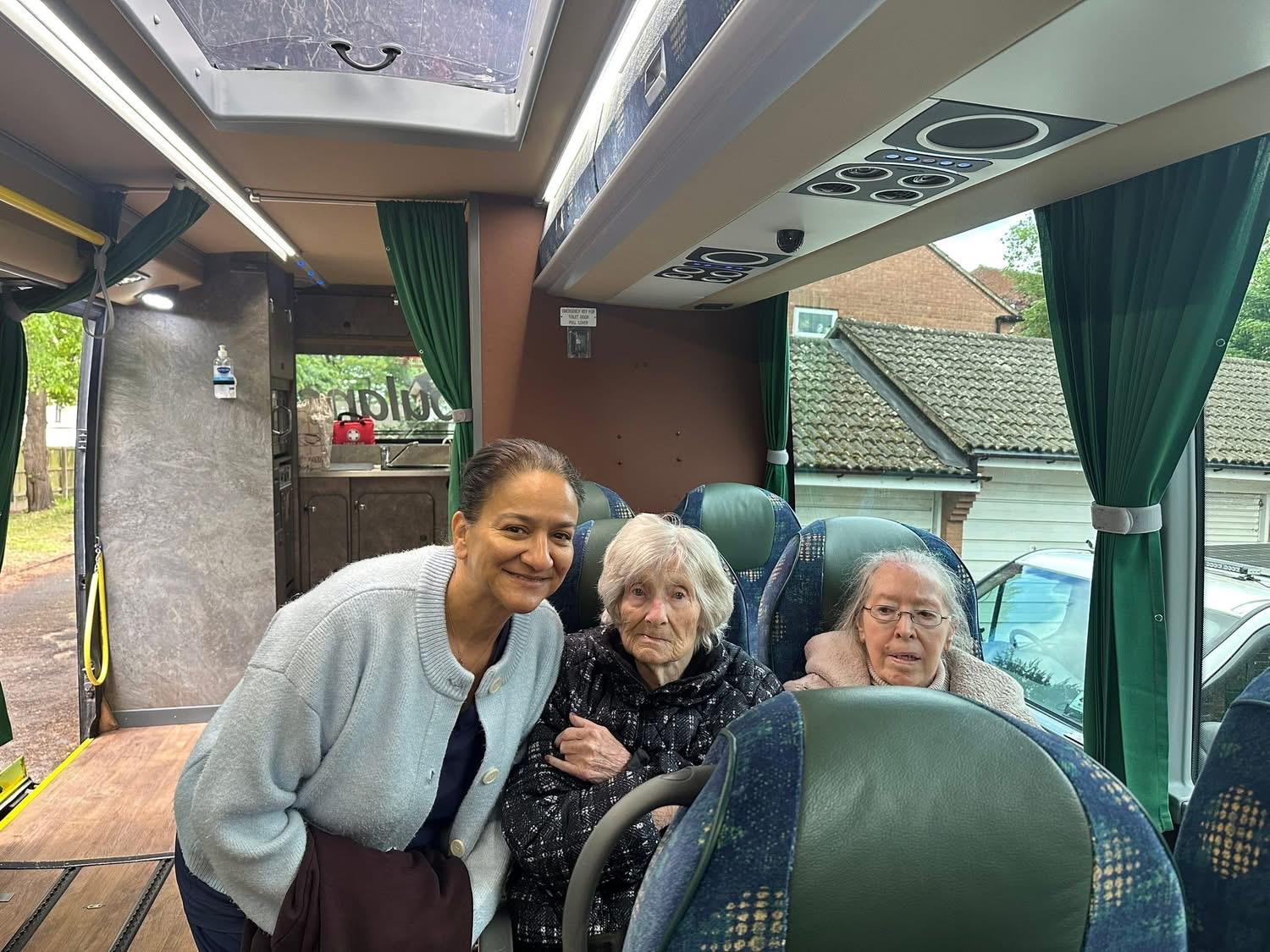 Three travellers enjoying the journey on board the coach