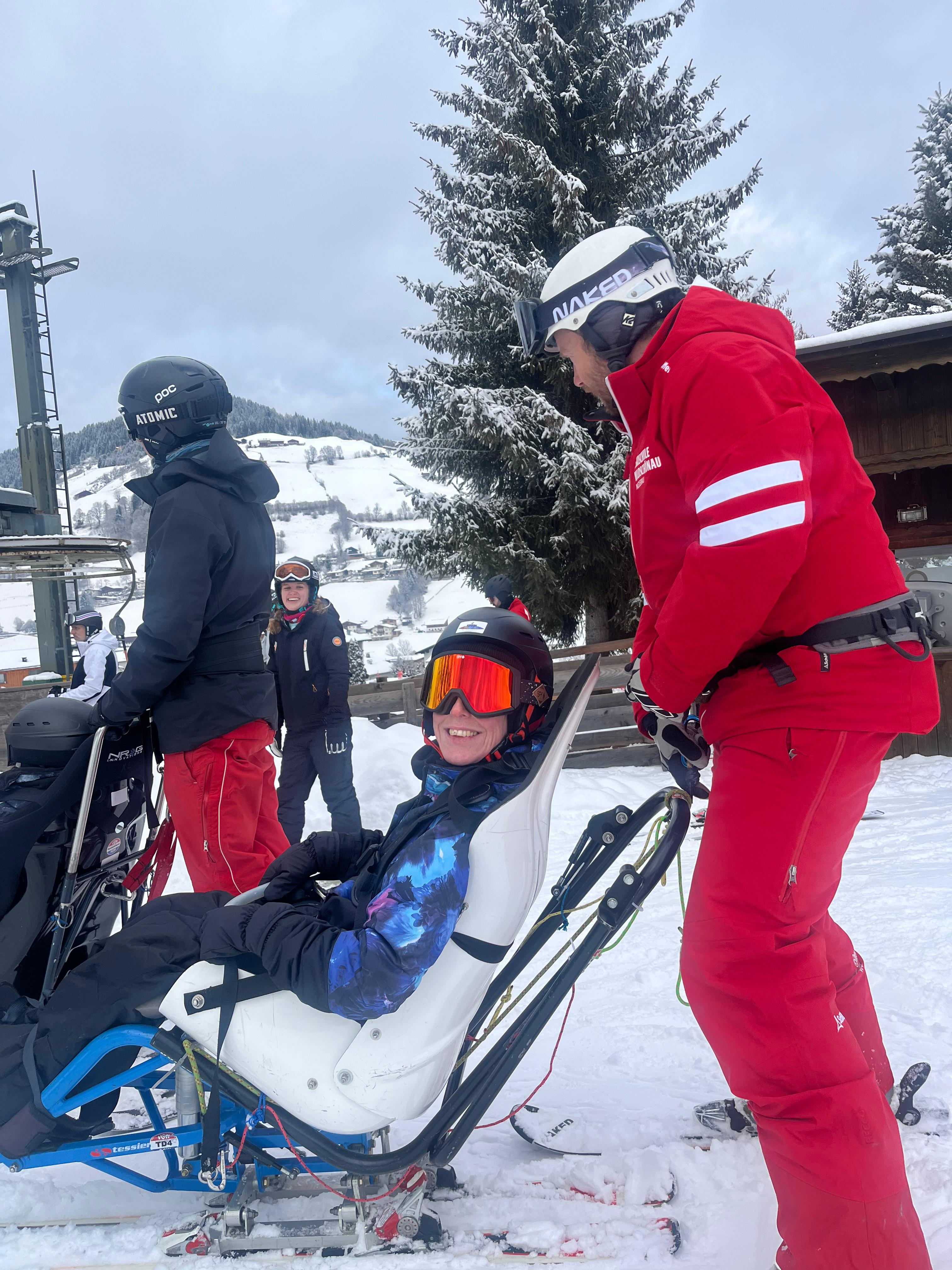 Adaptive skiing with volunteer instructors