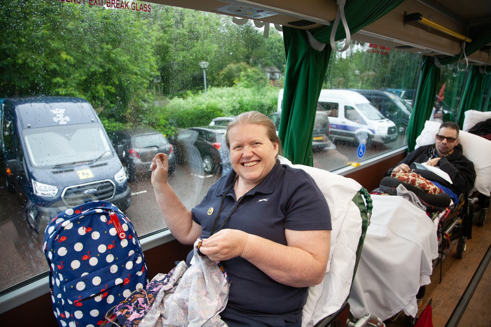 A passenger travelling on board a Jumbulance with stretcher beds alongside fixed seating.