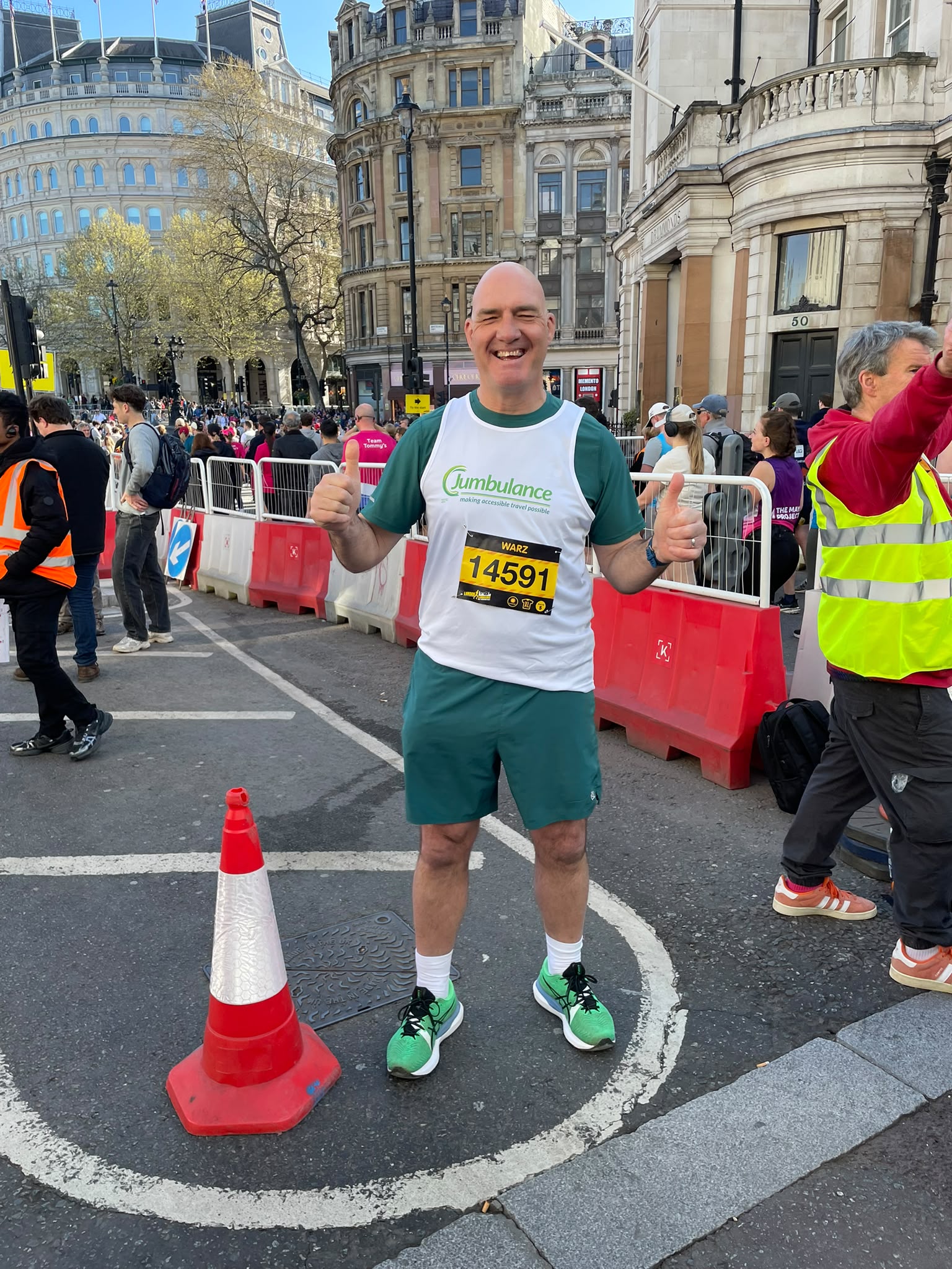 A Jumbulance runner giving a thumbs up at a race