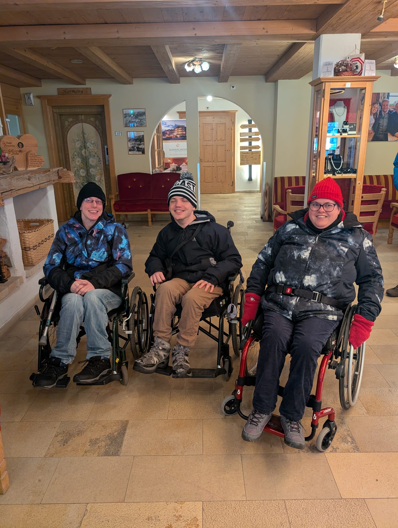 Travellers in wheelchairs at a ski resort