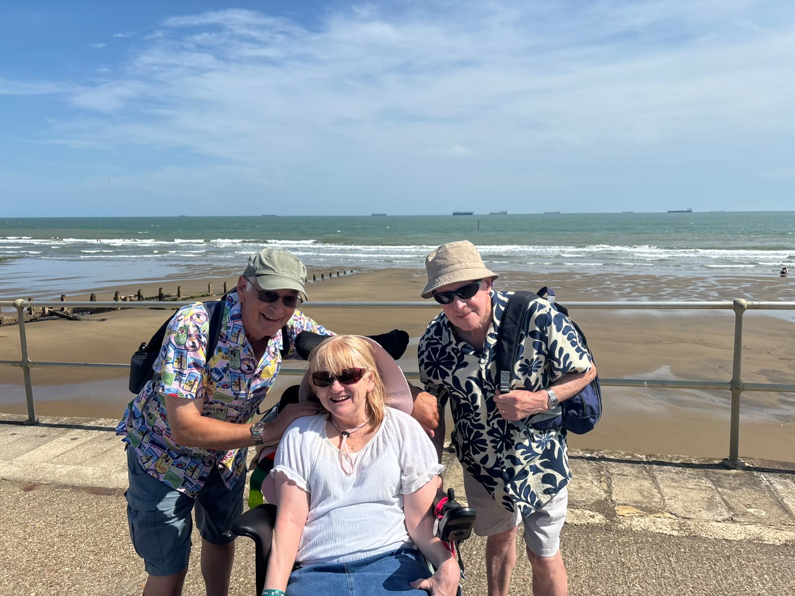 Travellers on a coastal promenade