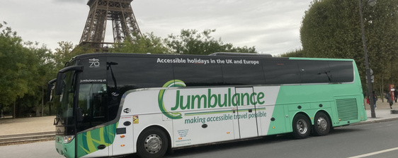 J3 Jumbulance coach parked in front of the Eiffel Tower in Paris