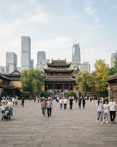 Modern Chinese city blending with historic imperial architecture and citizens in a public plaza.