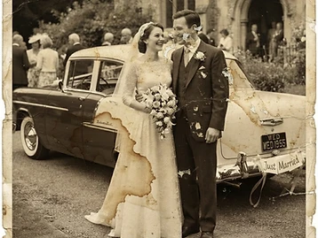 Before photo restoration — Heavy water damage and staining — the wedding couple, recovered.