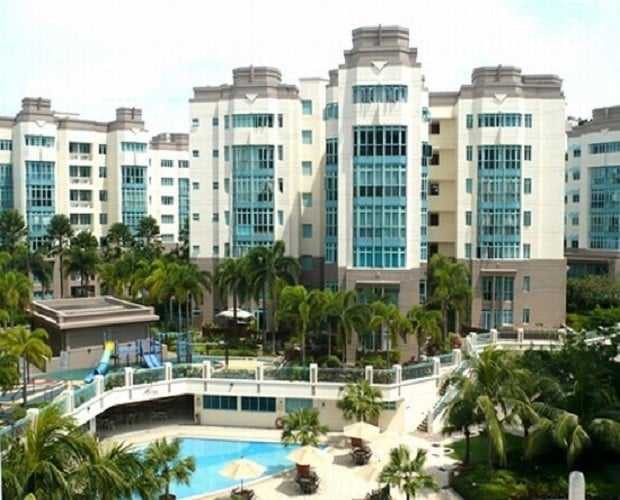 Ballota Park condominium exterior with swimming pool and landscaped grounds
