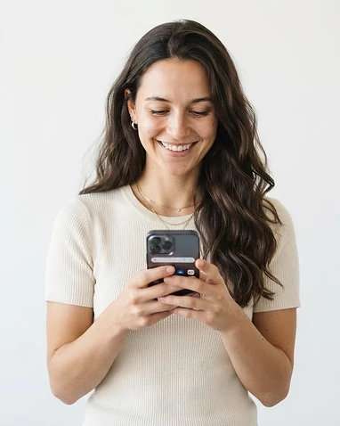 A woman recording a Shorts video review on her phone