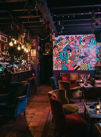 Wide view of the maximalist bar interior