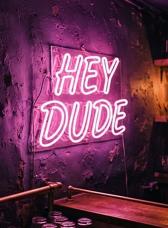Hey Dude neon sign glowing in the bar