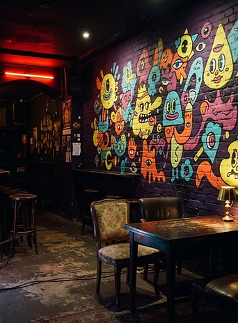 Colourful pop-art mural on a deep purple wall