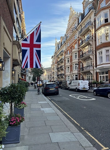 London street with Union Jack flag — commercial to residential conversion insight 2026