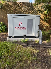 Kenerator generator installed outdoors on a concrete pad in a backyard