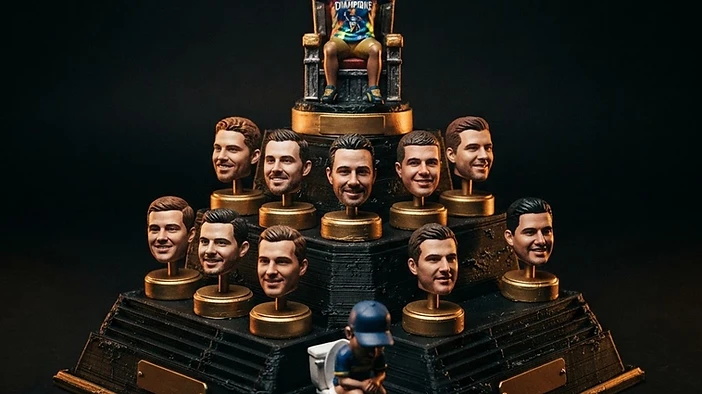 Custom fantasy football trophy monument with a 3D-printed champion on the throne