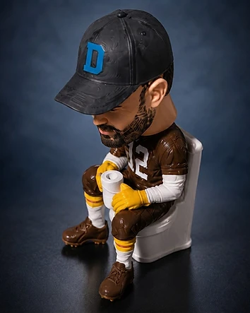 The last-place toilet of shame at the base of a custom fantasy football trophy
