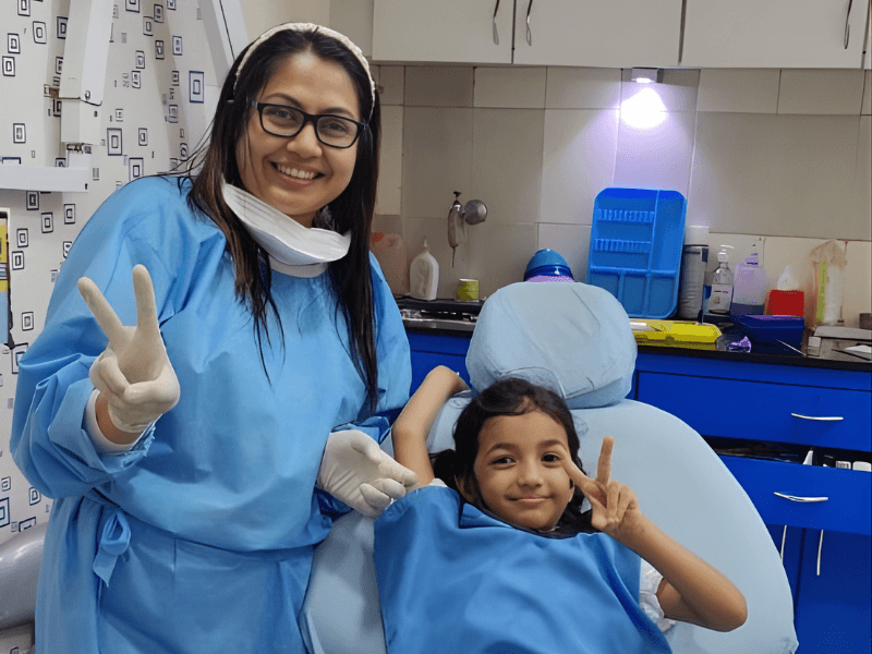 Dental Lounge & Implant Clinic with a happy patient