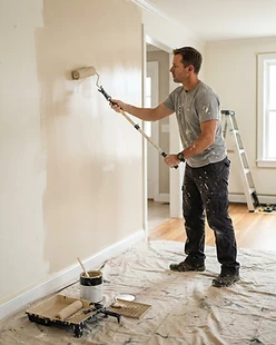 House painter rolling fresh interior paint