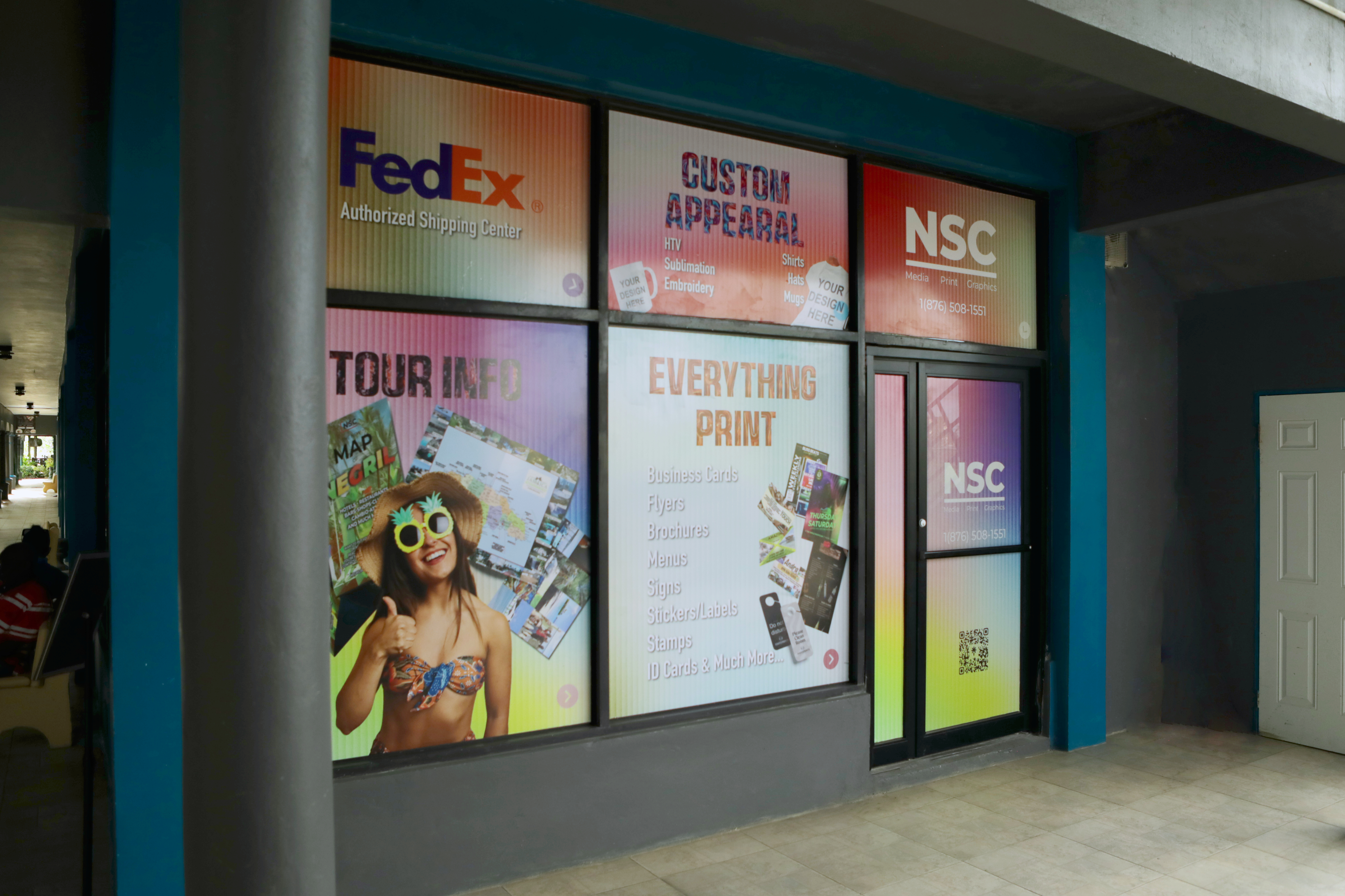 NSC storefront at Boardwalk Shopping Village in Negril at dusk