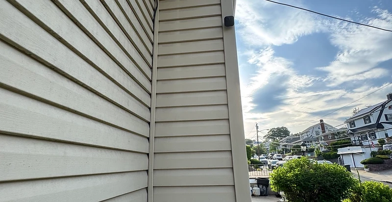Security camera installed on residential eave by Notify Technologies