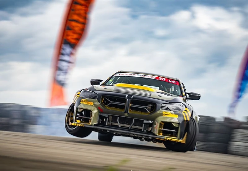 Modified BMW drift car in action on track