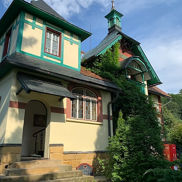 Villa Klein — exterior in daylight, view of the main facade with oriel window and entrance steps