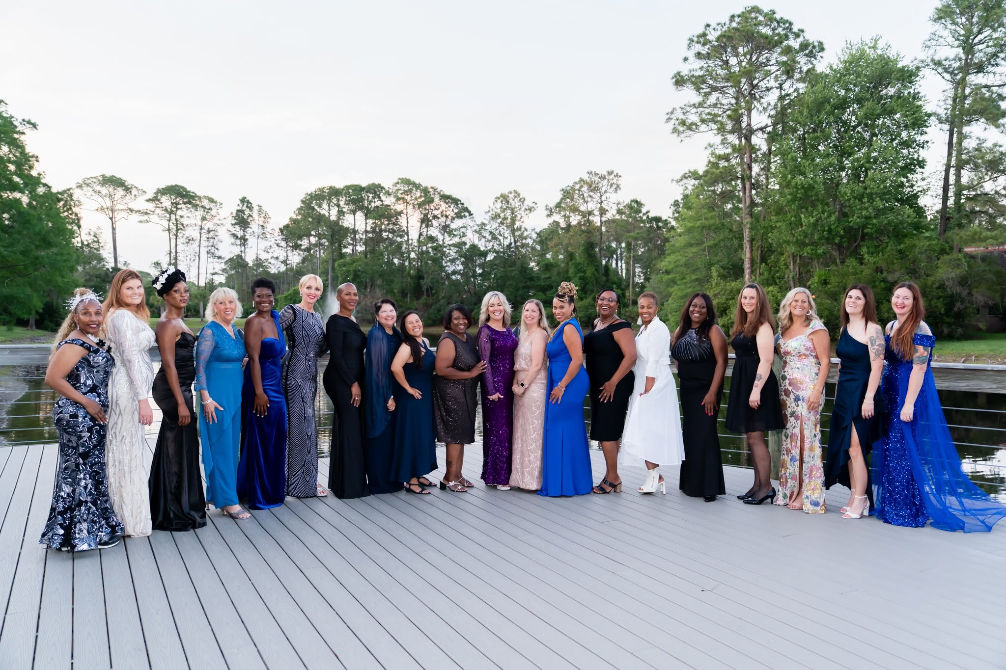 Women veterans and spouses in formal attire standing together