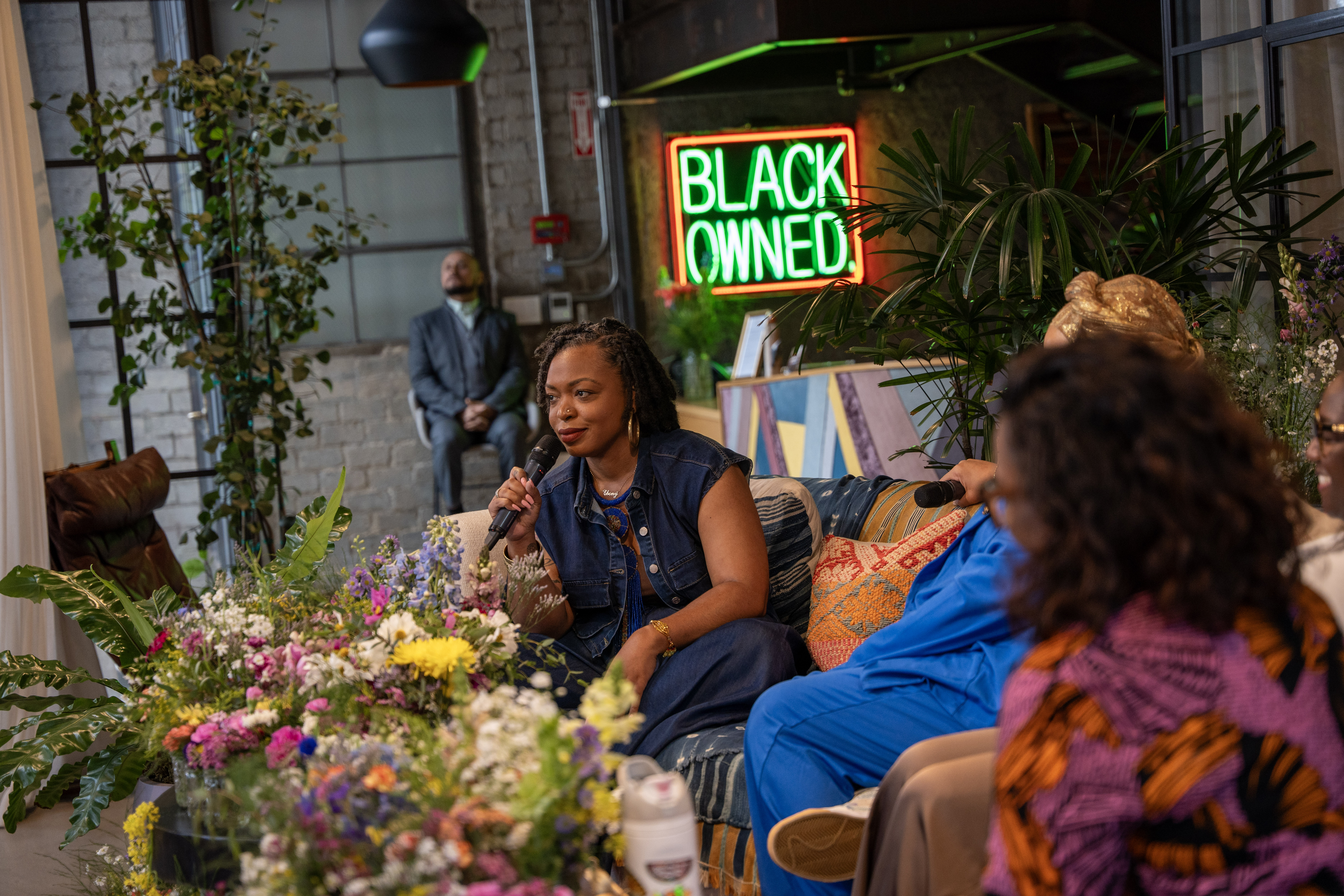 Ebony Booth on a community panel with fellow women of color leaders