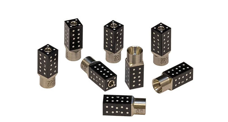 Collection of iCamBody reference markers showing black dot patterns and metallic bases