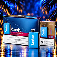 Cookies Rainbow Candy CK 15K Karton und Vape vor blauem Palmenhintergrund