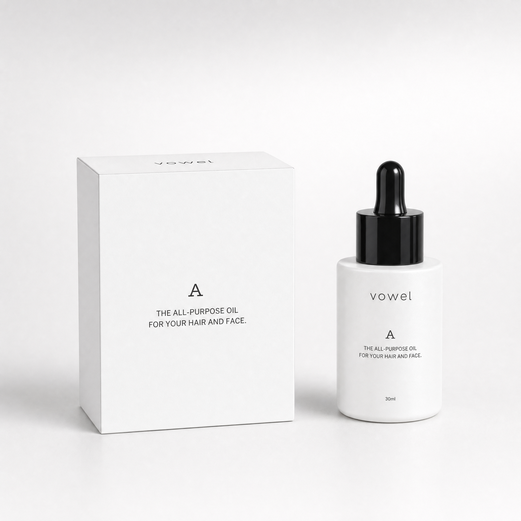 The vowel A box and bottle side by side on a light grey surface