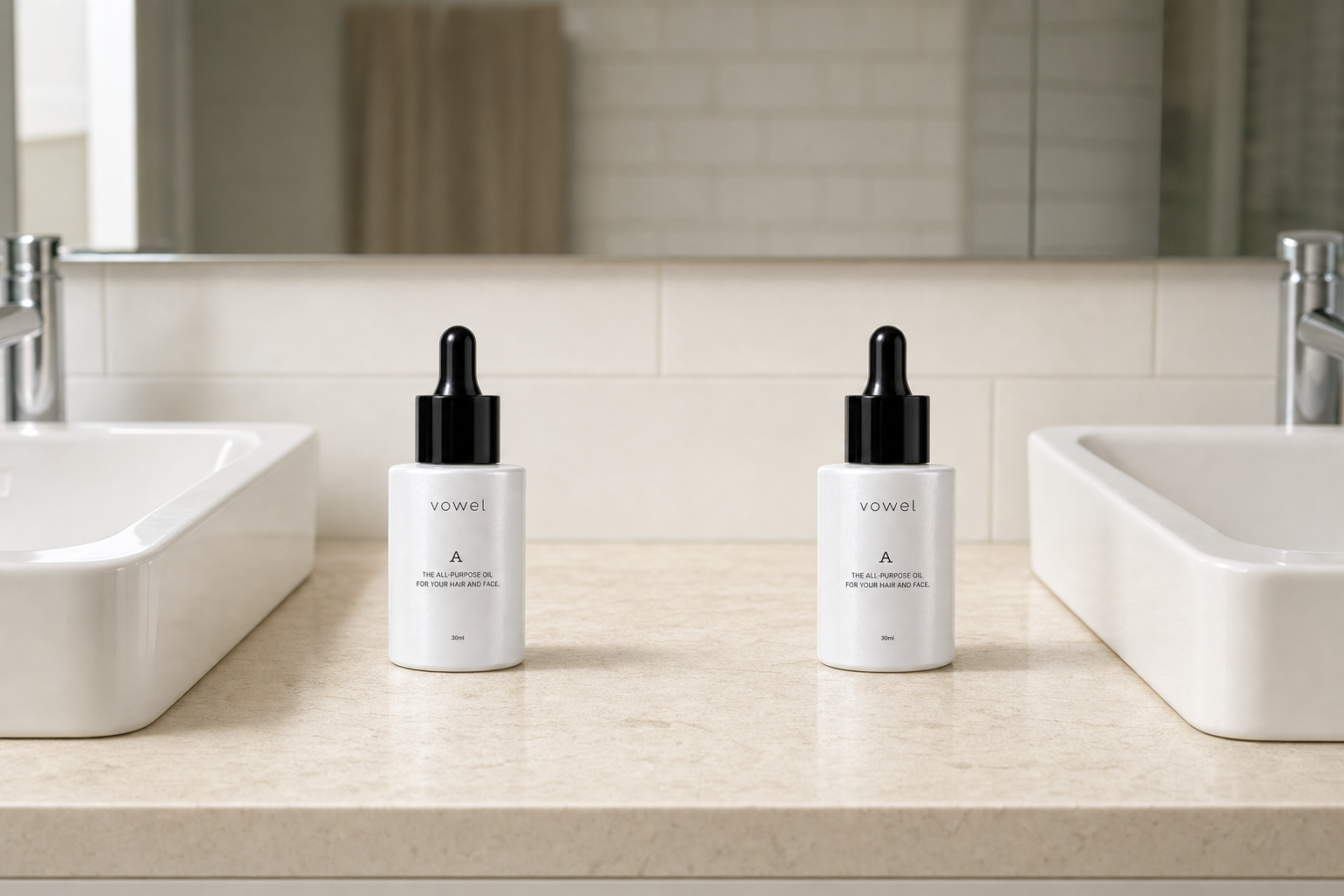 Two vowel A bottles on a limestone bathroom vanity