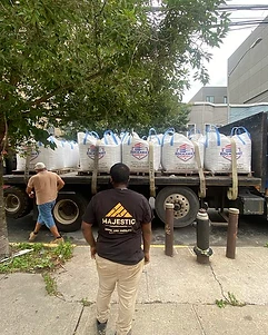 Majestic team receiving a building-supply delivery