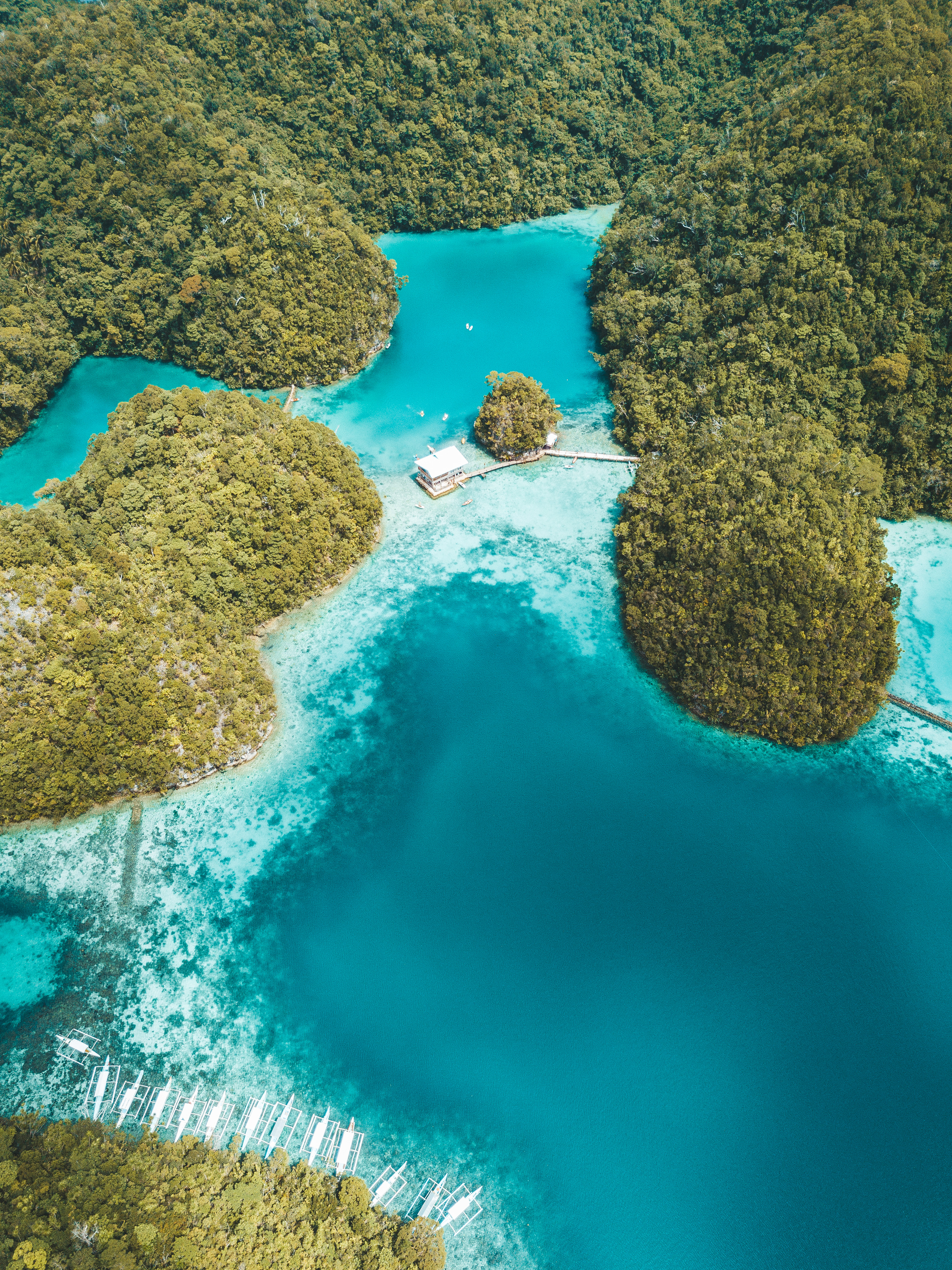 Top-down aerial view of a coastal lagoon, shot within Open category limits