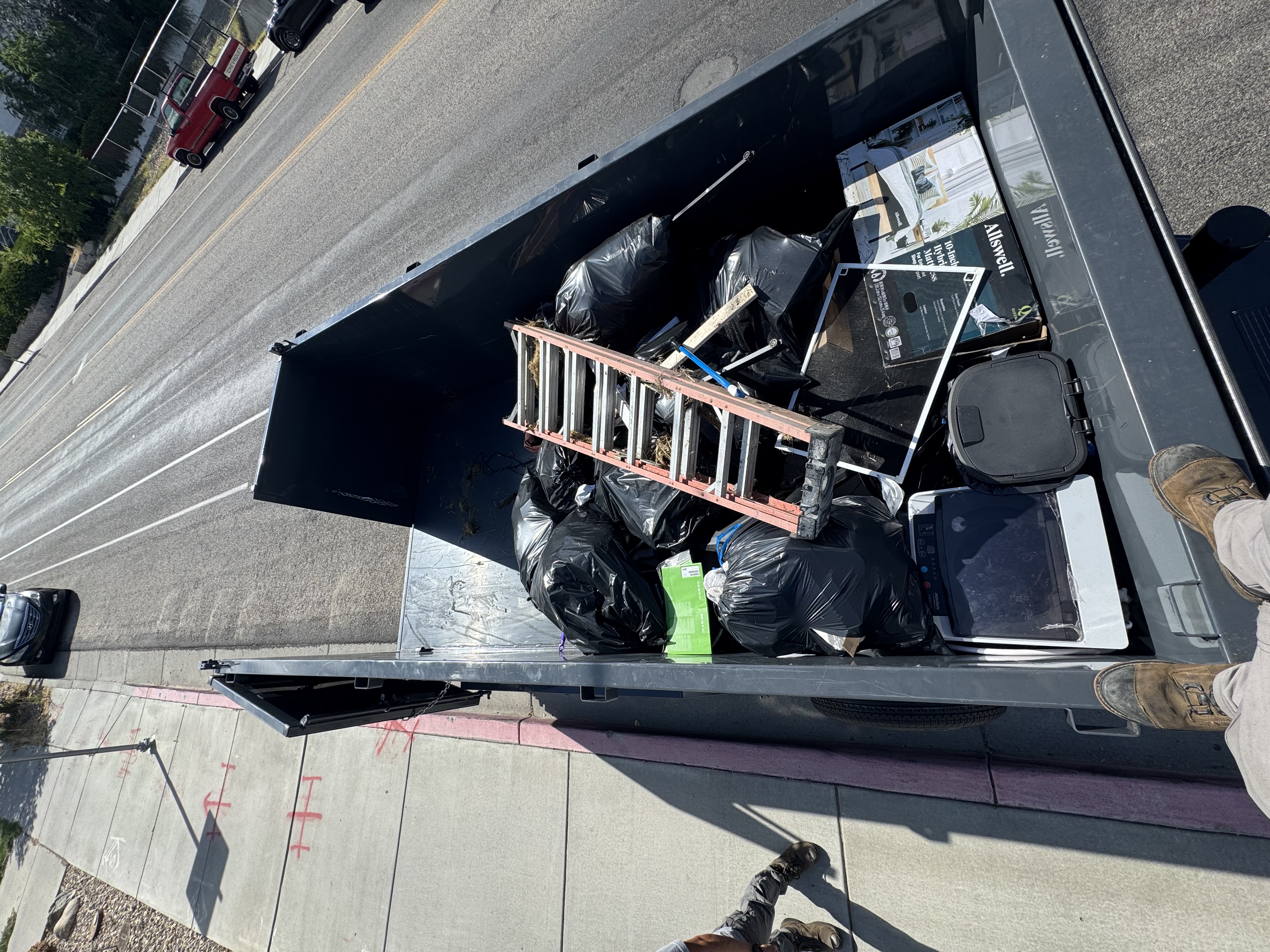 Loaded junk removal trailer after a haul
