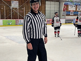 Robert Manning in hockey referee uniform at the rink