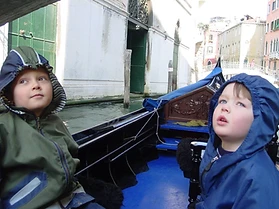 Sons in a gondola on the Grand Canal, Venice
