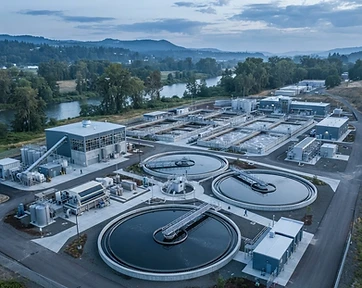 Wastewater treatment facility with sludge-handling equipment