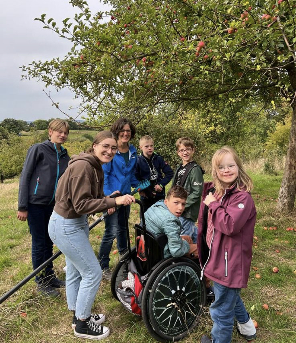 A group of Daybound members of all ages gathered together at an apple orchard outing