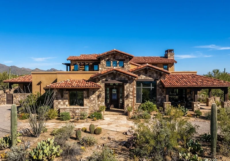 Newly installed clay tile roof on an Arizona home against a deep blue desert sky