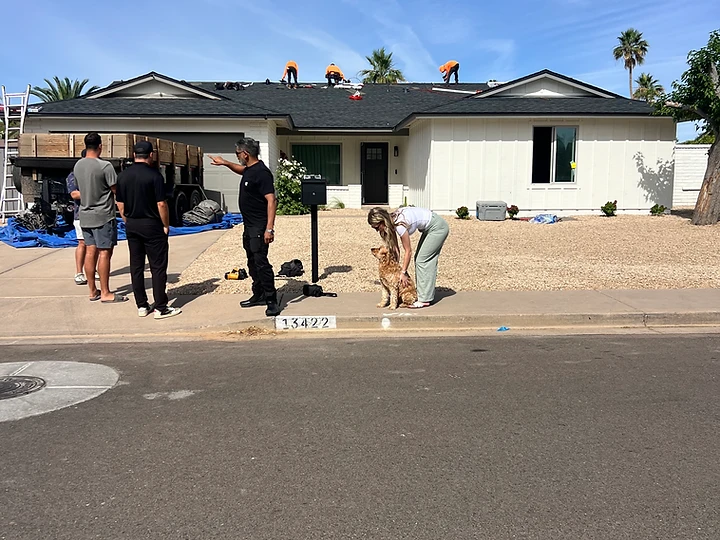 Outlaws Roofing crew inspecting and working on an Arizona roof