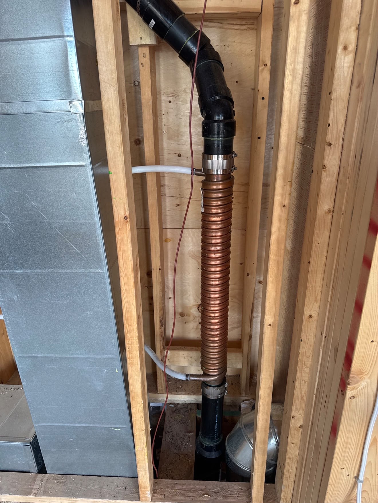 Drain water heat recovery copper coil installed in line
