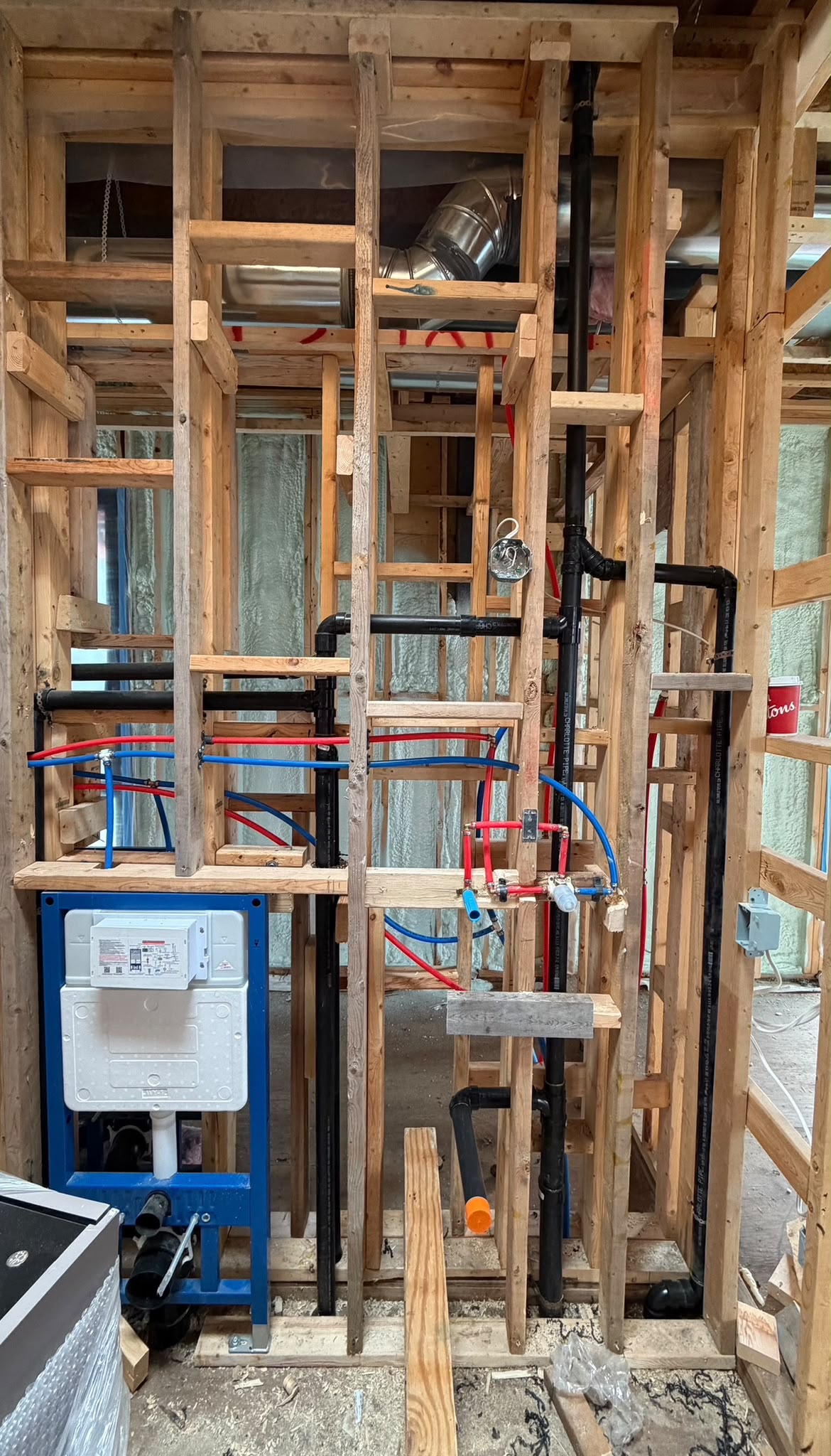 Professional plumbing rough-in during a home renovation