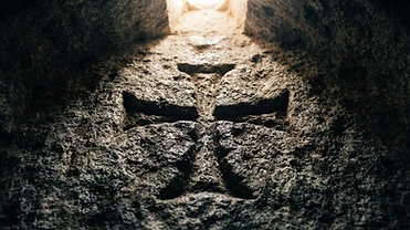 Weathered Templar cross carved into ancient granite