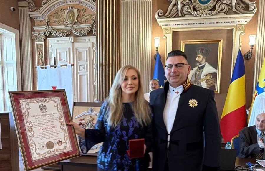 Helena B. Scott receiving the Meriti Crux (Cross of Merit) from the Ordre Souverain des Templiers de Saint-Martin (OSTSM) at the International Conference on Saint Martin as Precursor to the Christian Knightly Orders, Arad, Transylvania, 24 April 2026.