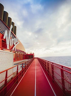 The running track looping the deck at sea aboard a Virgin Voyages ship