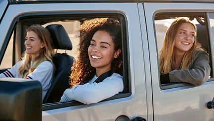Friends enjoying a ride together in their car