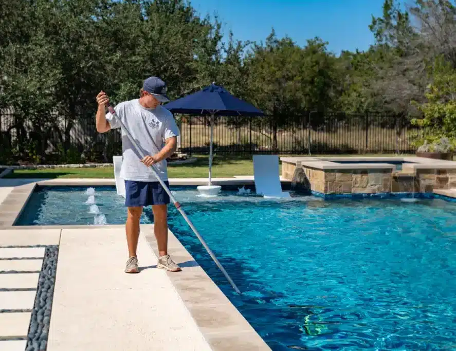 A pool service professional at work