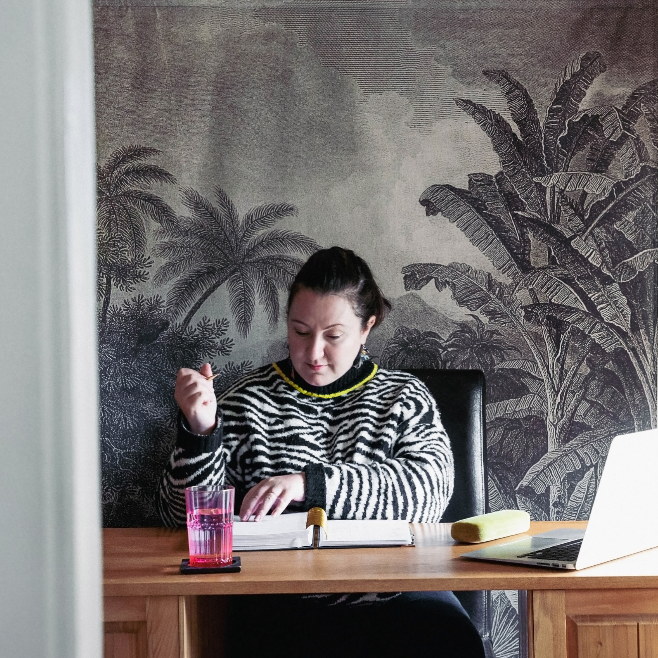 Laura working at her desk