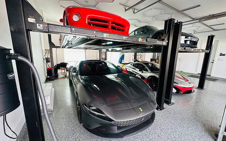 Finished granite-look flake floor in a luxury garage — flake system training