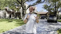 Jeremy gesturing as he explains a project on a residential driveway